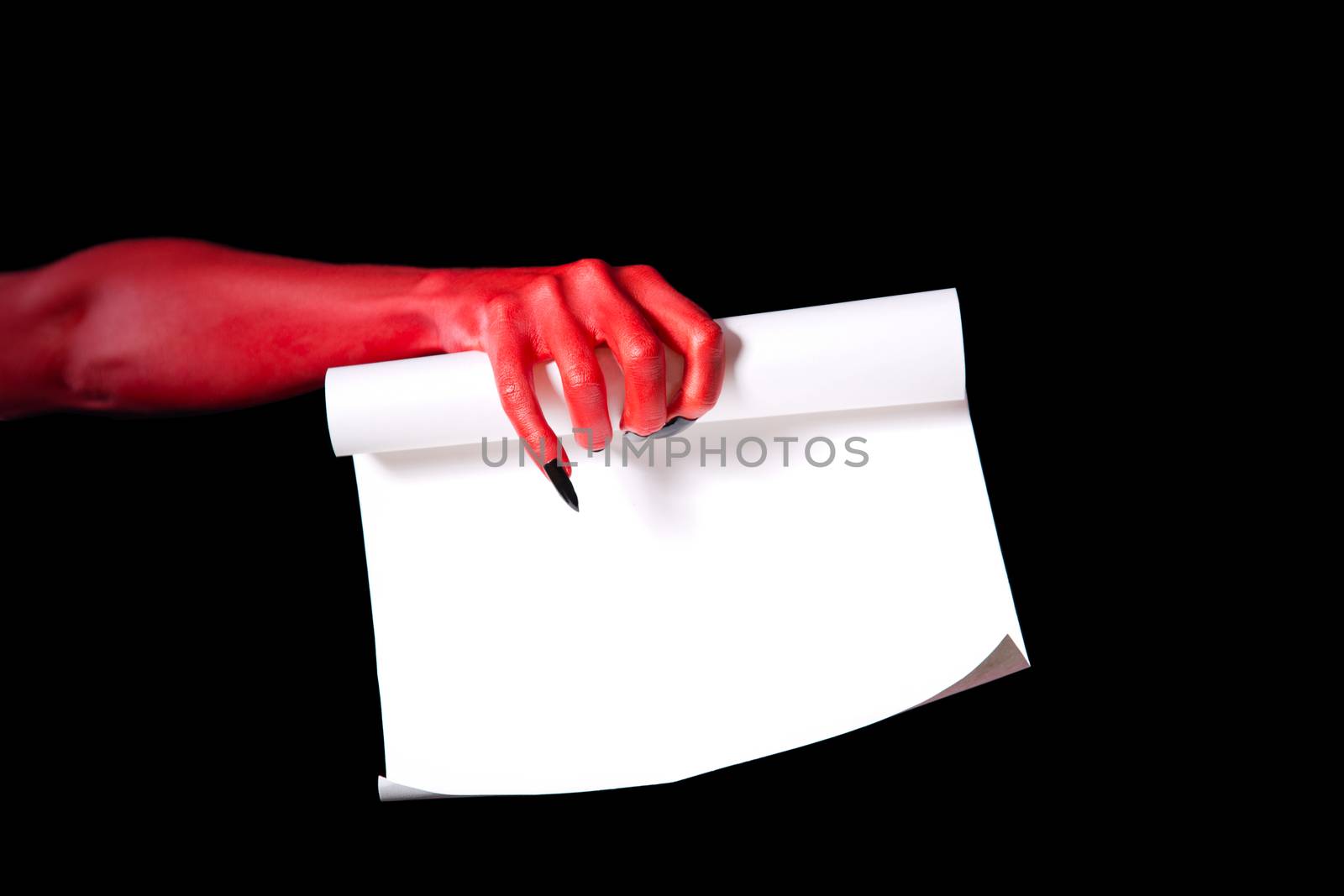 Red devil hand holding paper scroll, Halloween deal with devil concept