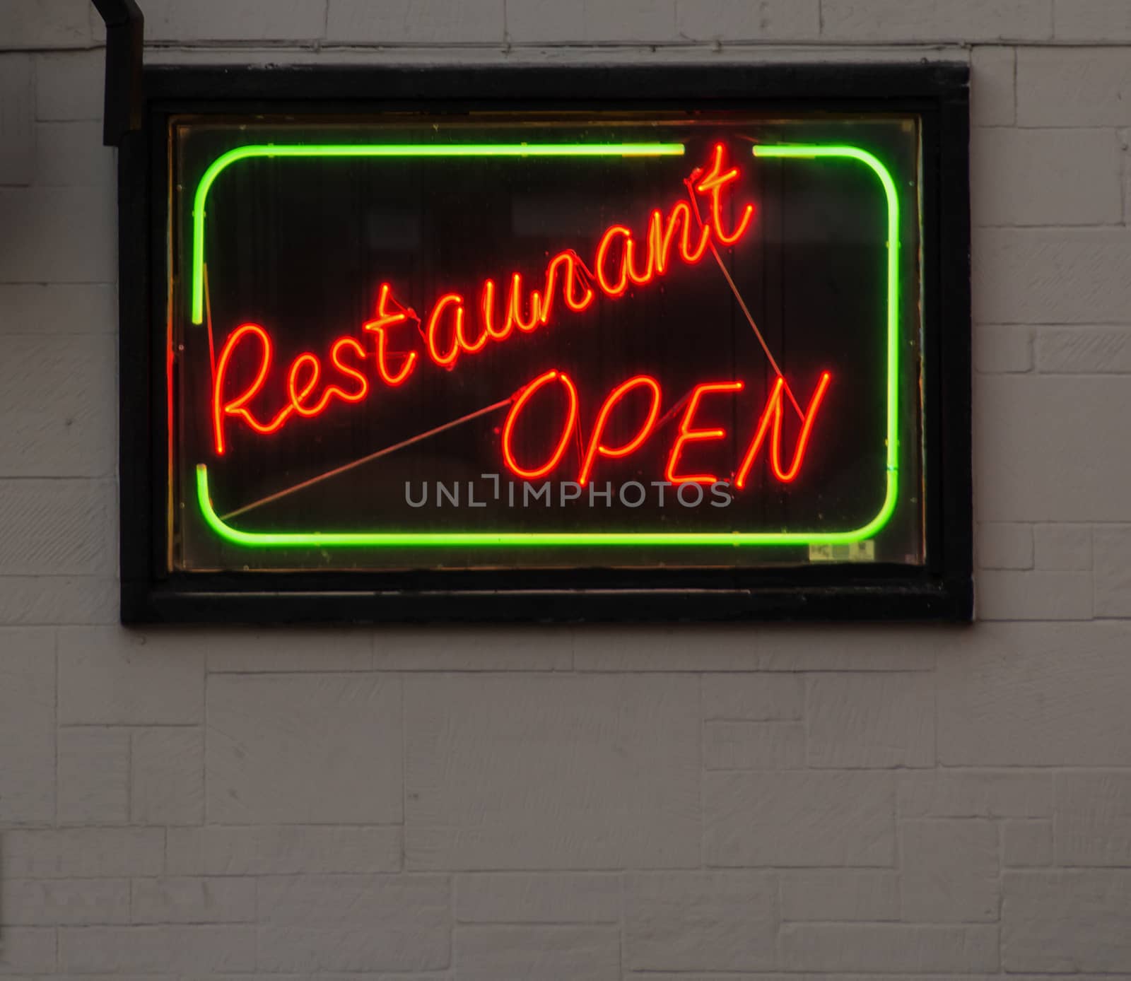 A neon sign, signifying an open restaurant