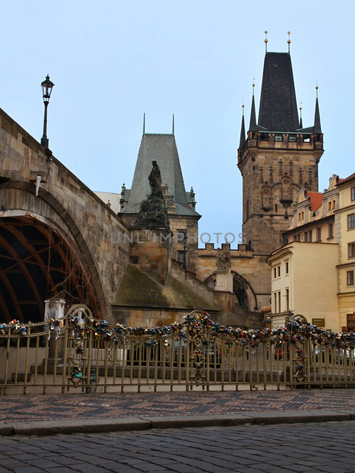 Photo of Charles bridge in Prague, Czech republic with the view onto old houses, towers and Vltava river.