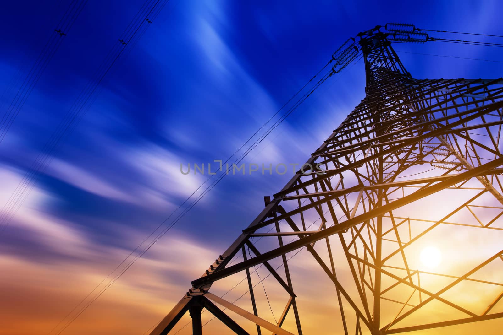 High voltage tower at sunset