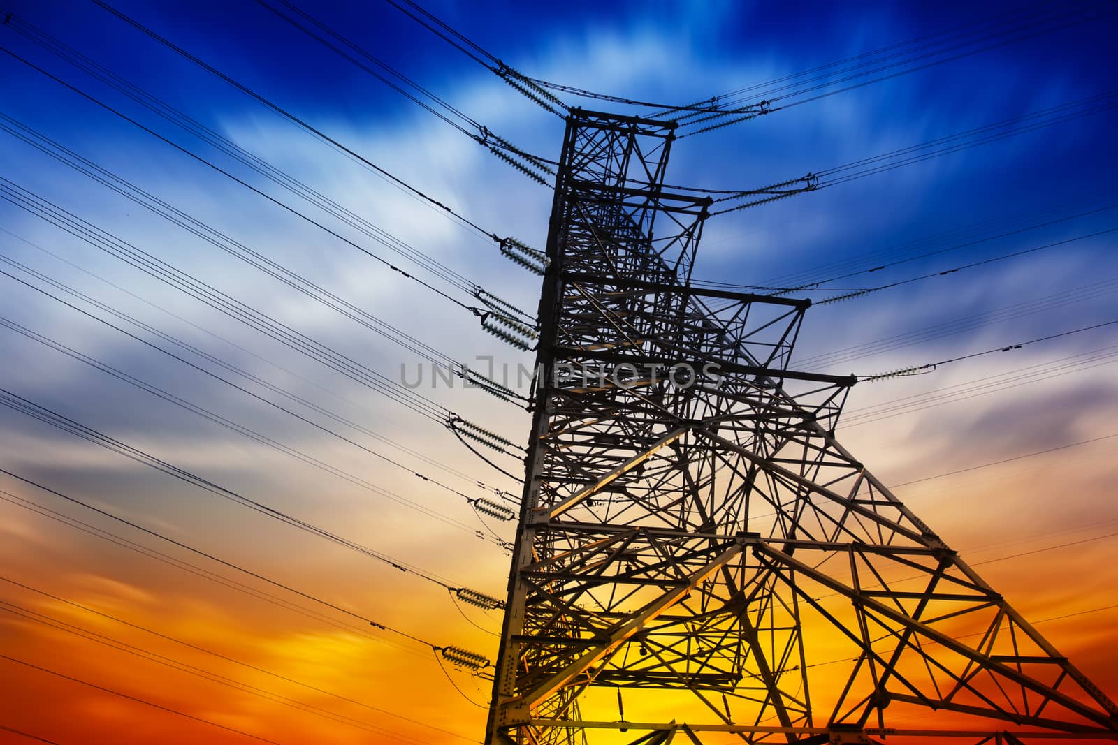 High voltage tower at sunset