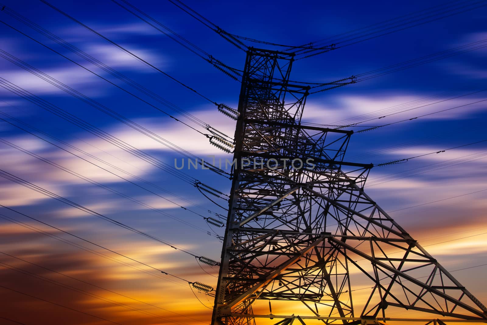 High voltage tower at sunset