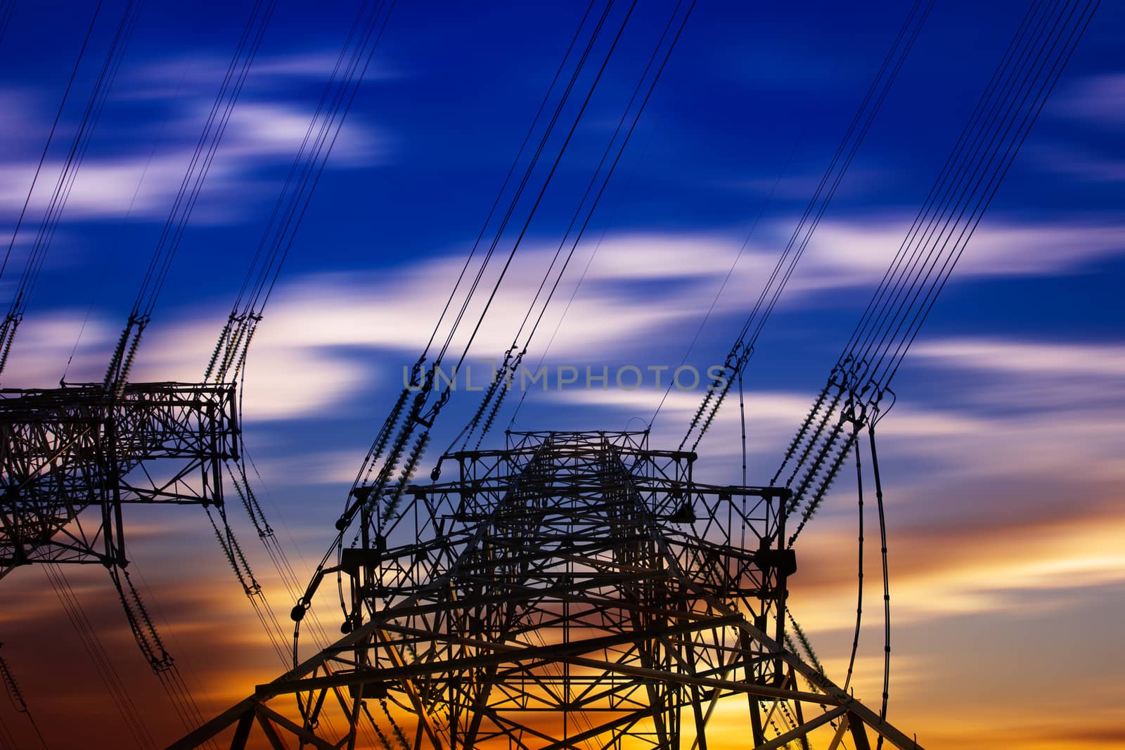 High voltage tower at sunset by long8614