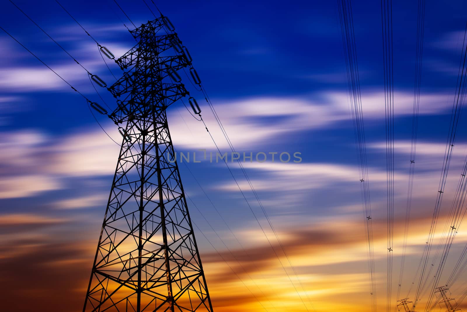 High voltage tower at sunset