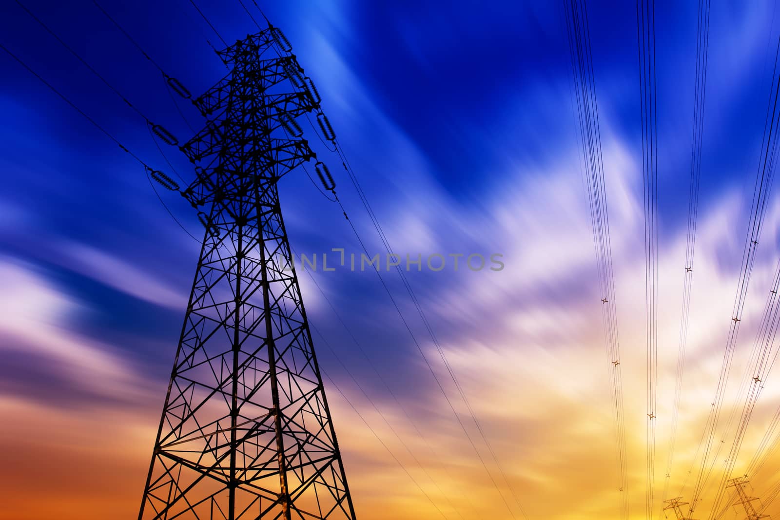 High voltage tower at sunset