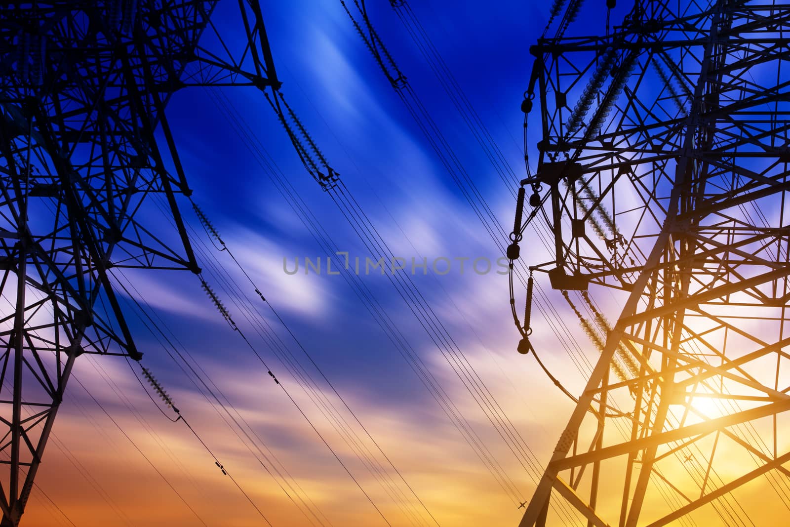 High voltage tower at sunset by long8614