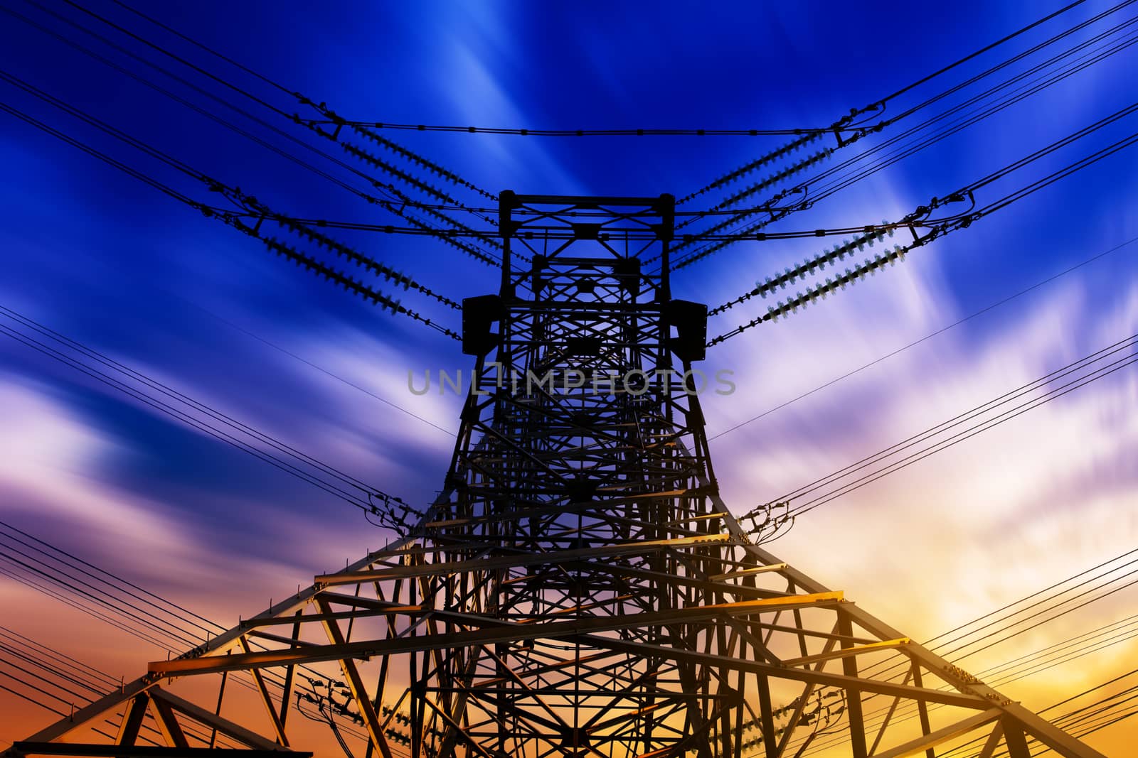 High voltage tower at sunset