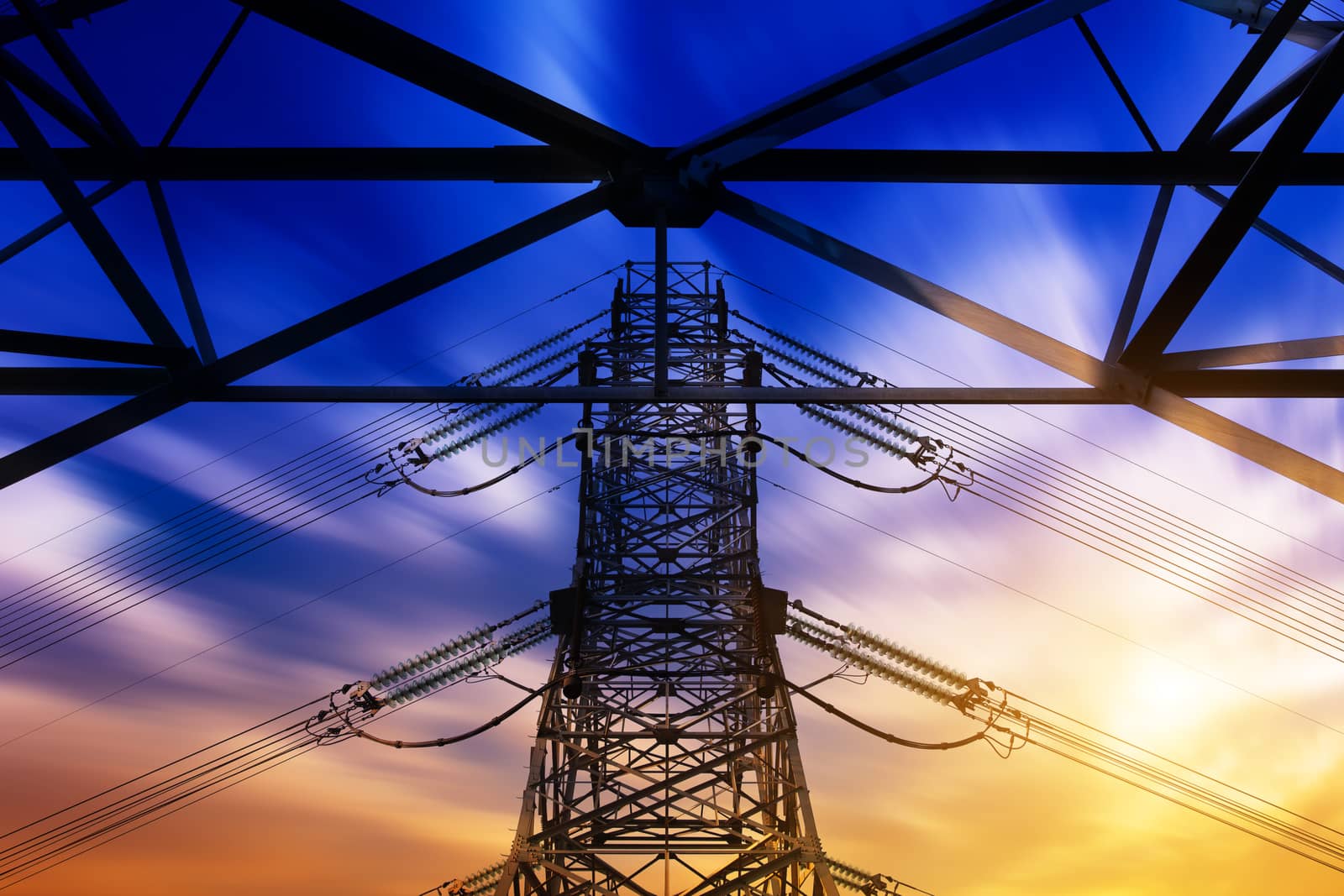 High voltage tower at sunset