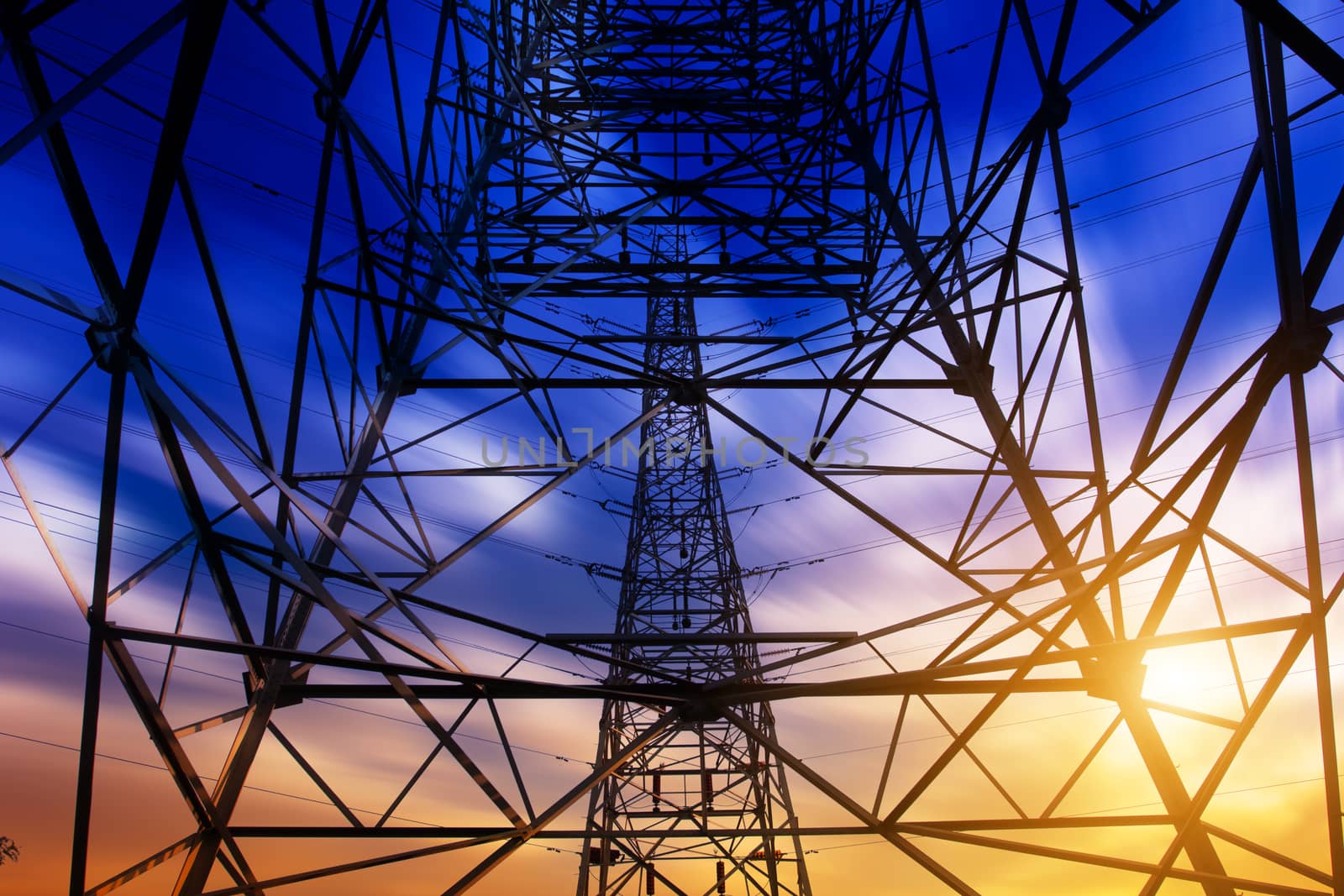 High voltage tower at sunset
