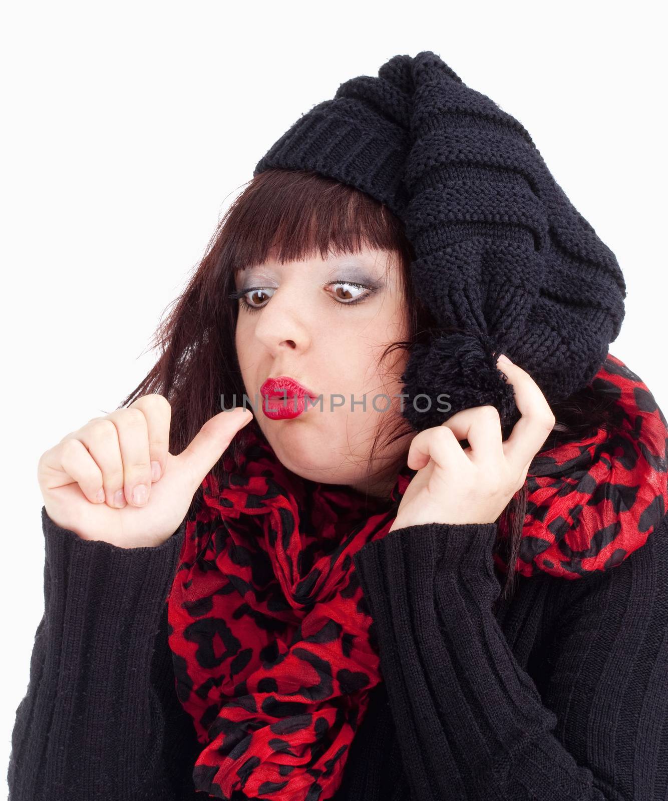 Young Woman with Black Cap Looking at her Thumb - Isolated on White