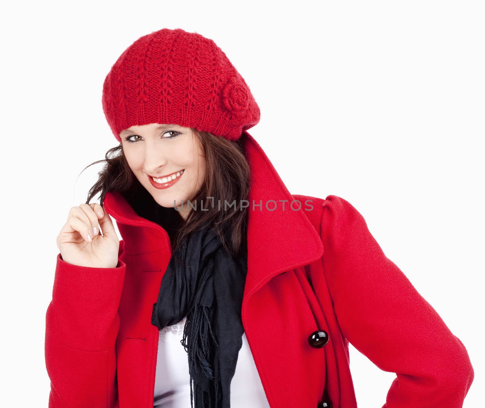 Young Woman in Red Coat and Cap Smiling by courtyardpix