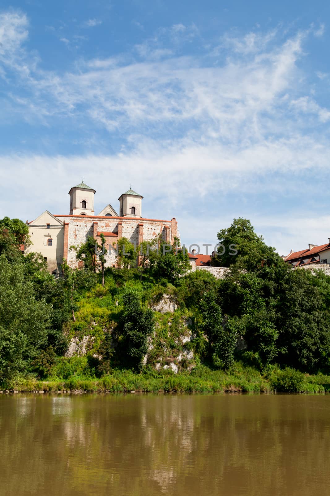 The Benedictine Abbey in Tyniec in Poland with wisla river on blue sky background