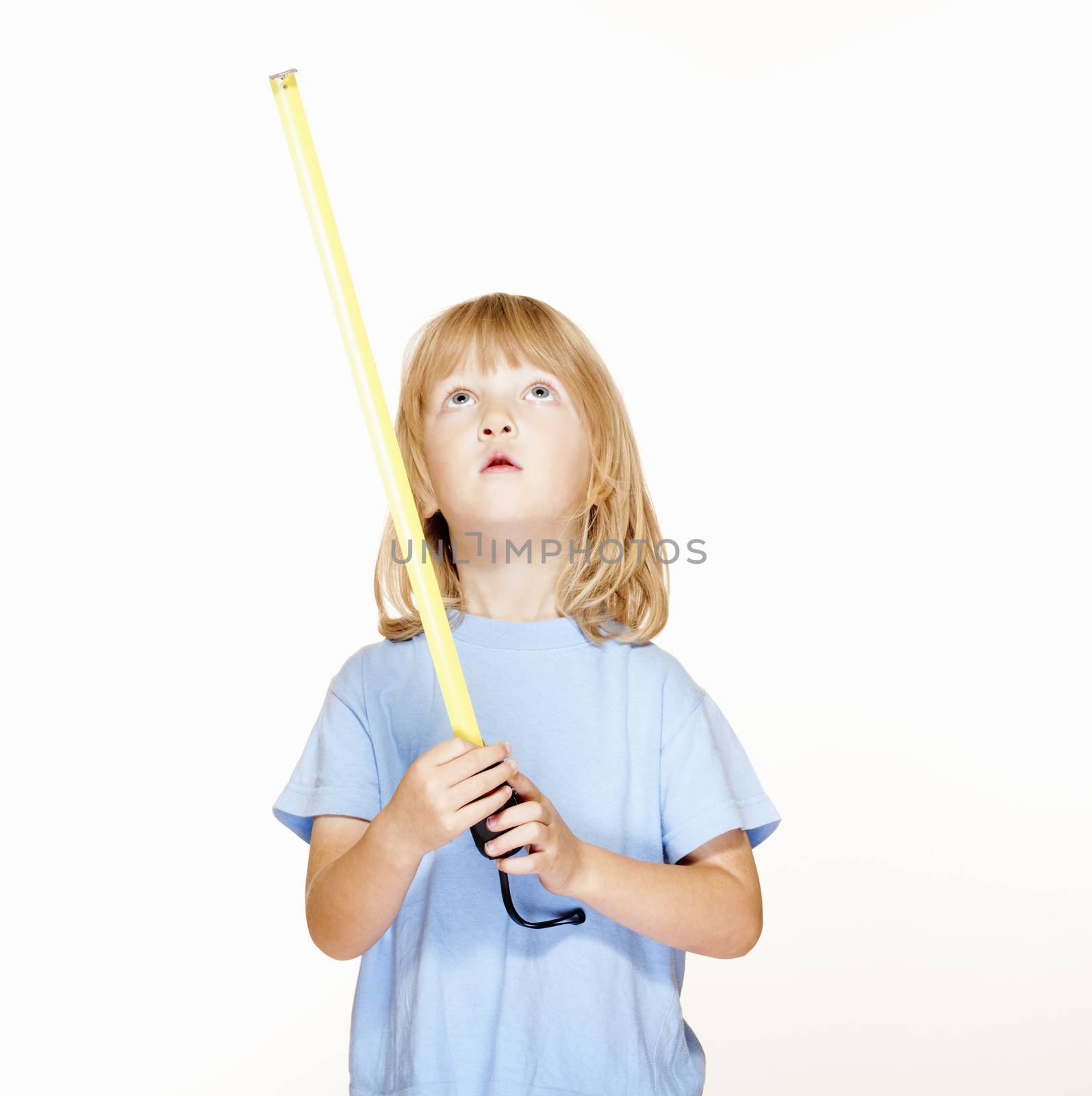 boy with long blond hair holding a tape measure, looking up up