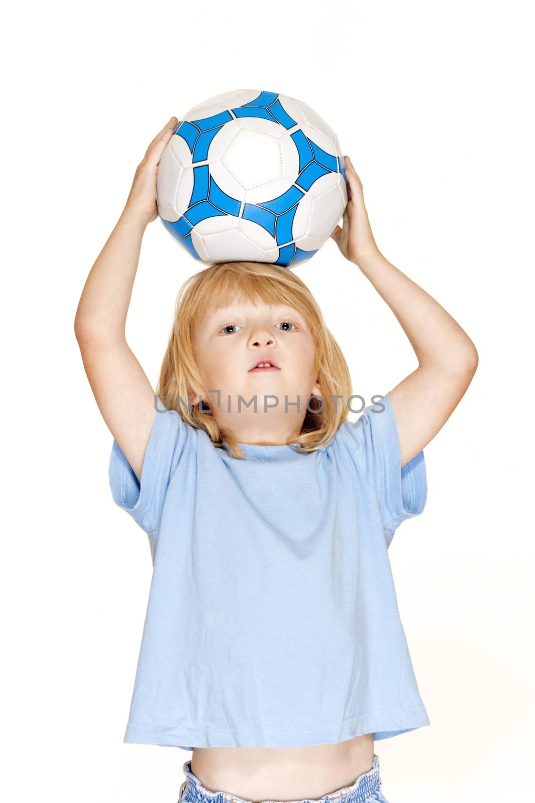 boy with long blond hair holding a football - isolated on white