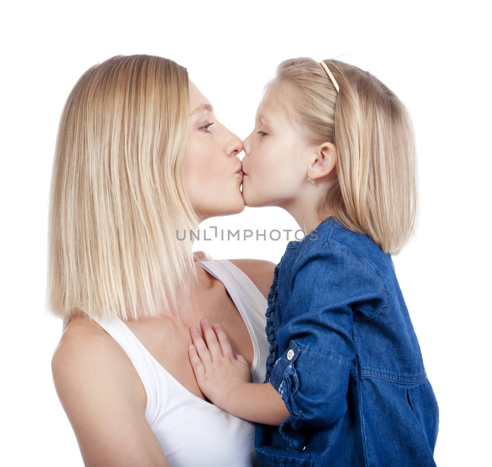 mother and daughter kissing by courtyardpix