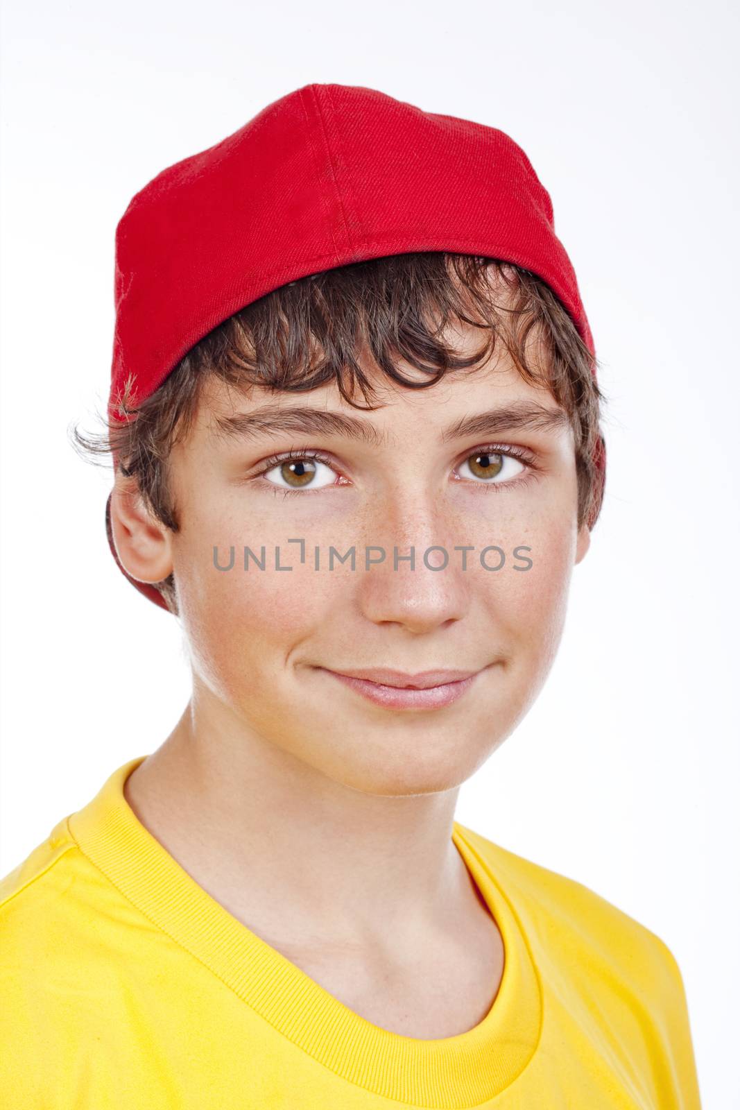 portrait of a teenage boy in red baseball cap -isolated on white