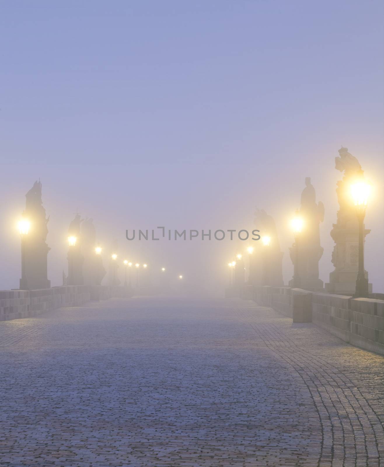 czech republic prague - charles bridge on foggy morning