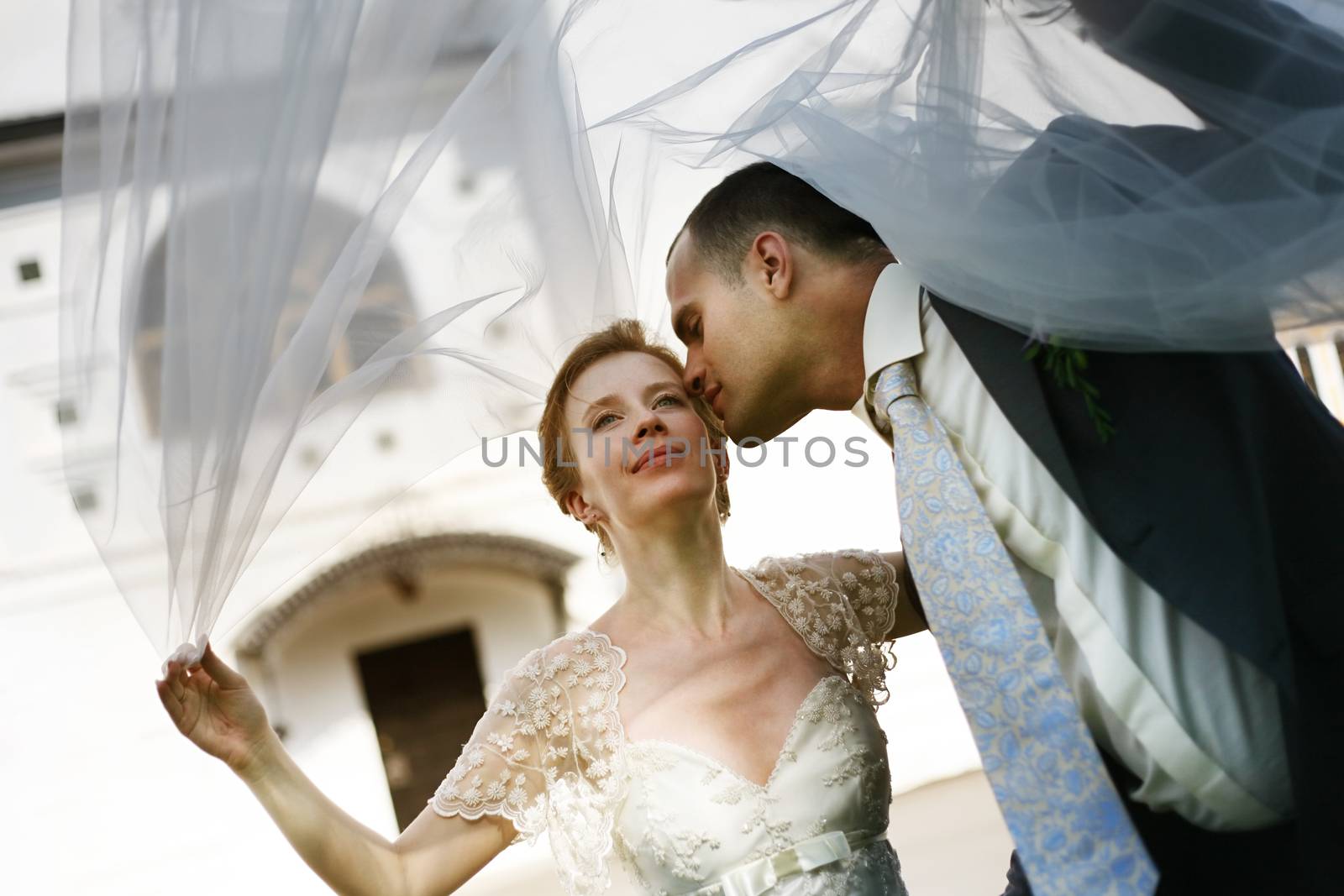 Beautiful the bride and the groom kiss