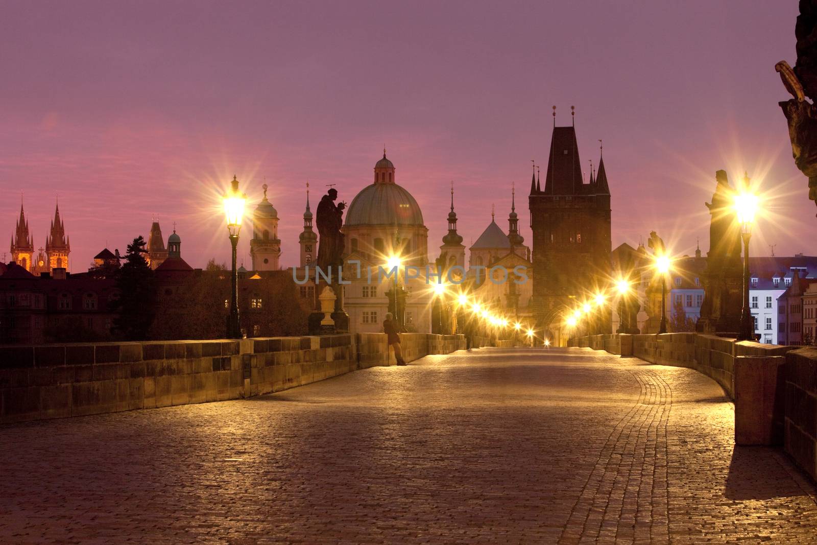 czech republic prague - charles bridge and spires of the old town at dawn