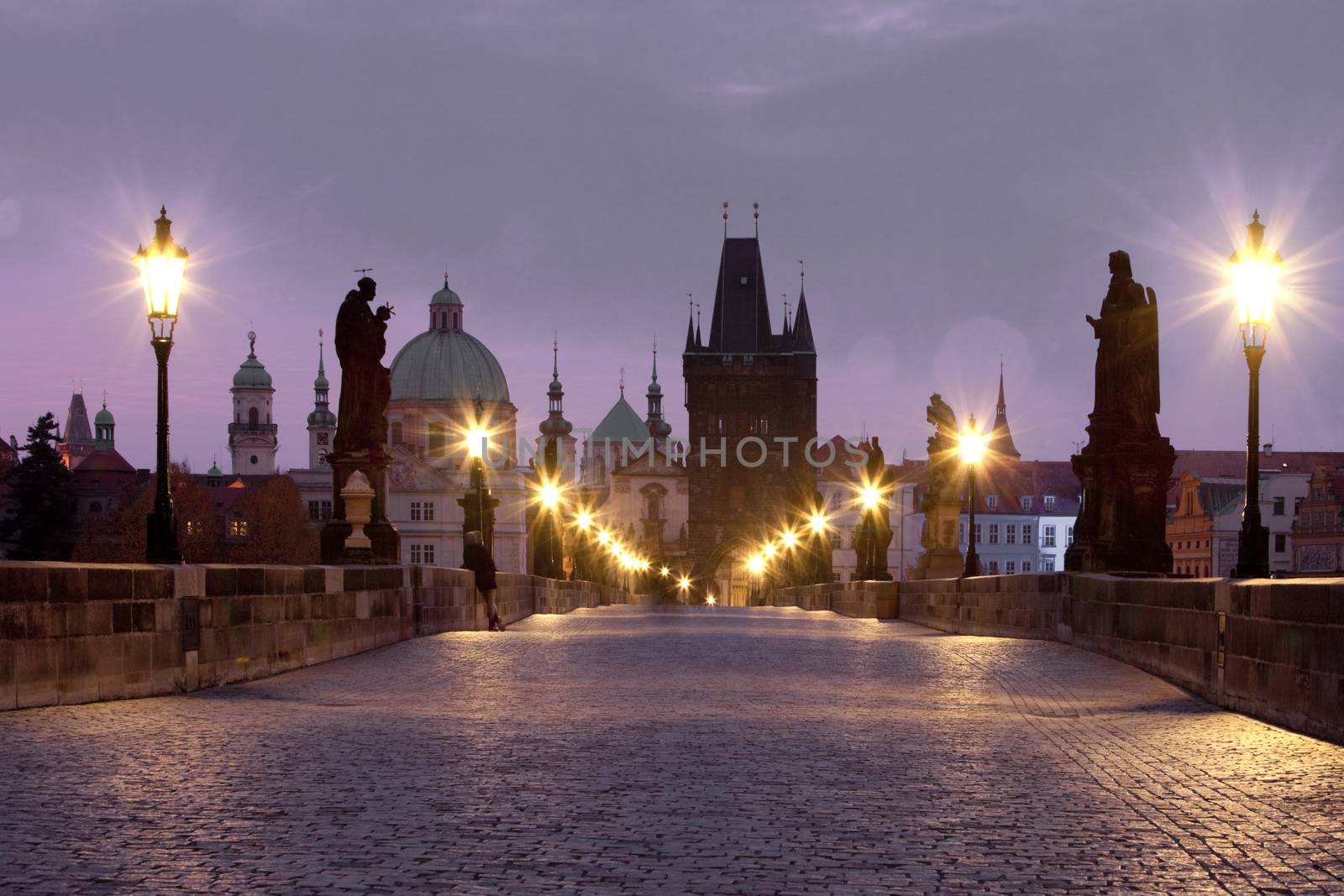 czech republic prague - charles bridge and spires of the old town at dawn