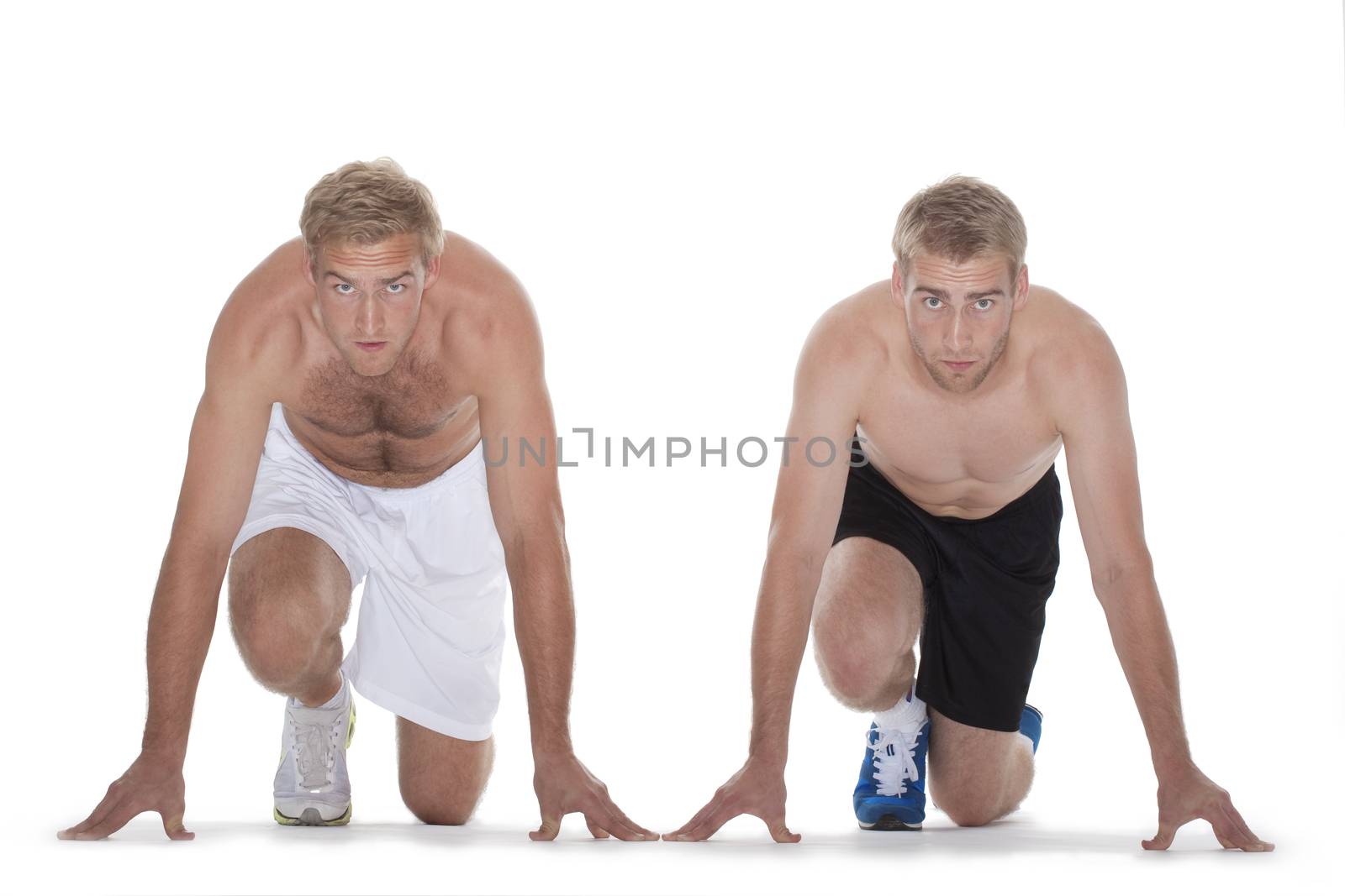 two sprinters getting ready to start the race - isolated on white