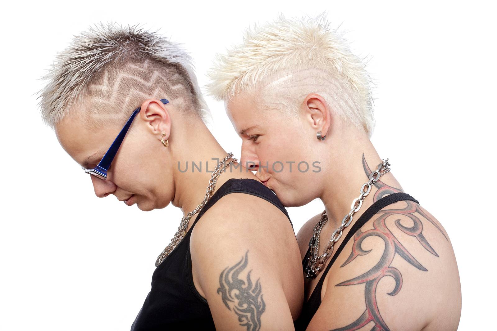 two lesbian woman with punk hairstyle kissing - isolated om white