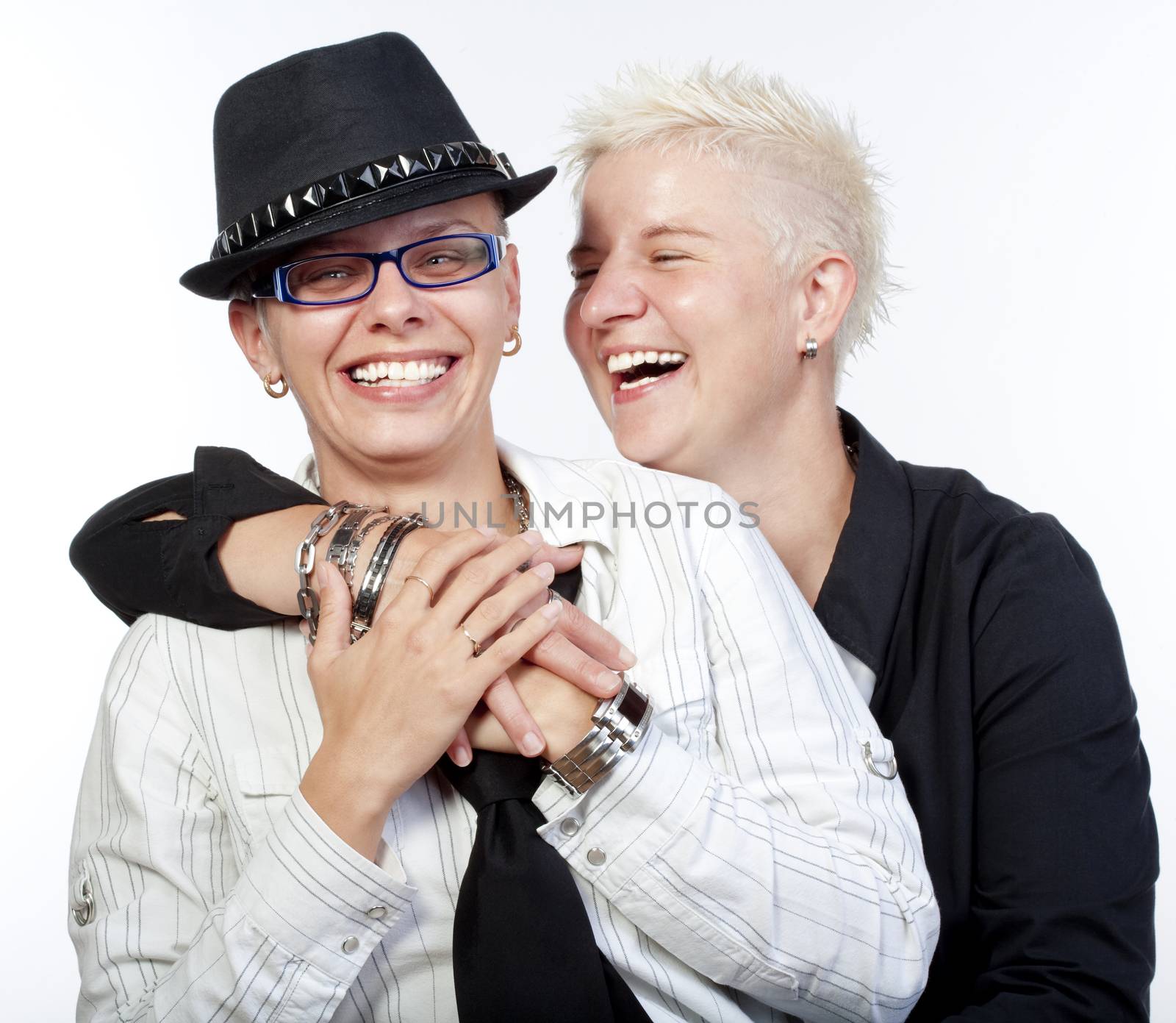 two lesbian woman with punk hairstyle laughing - isolated om white