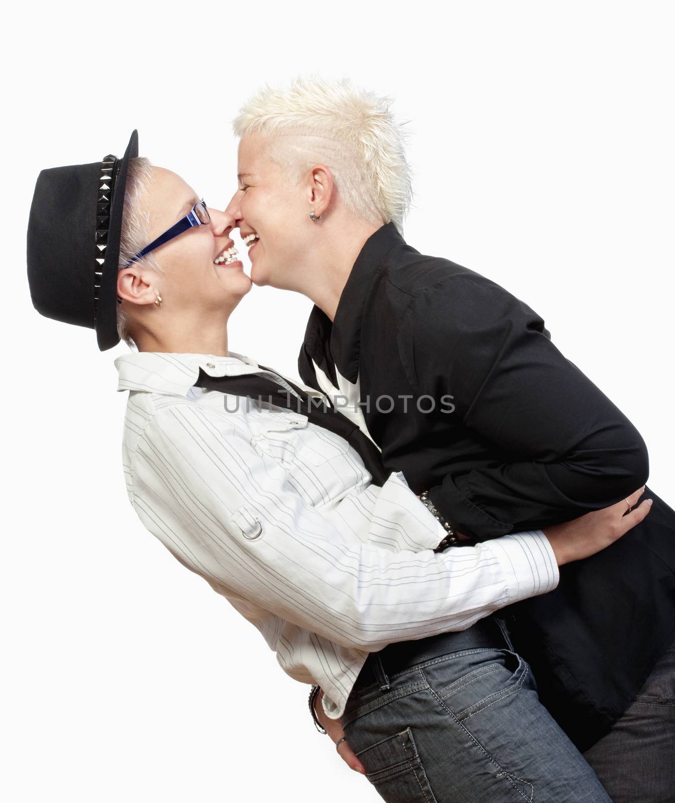 two lesbian woman with punk hairstyle embracing, smiling - isolated om white