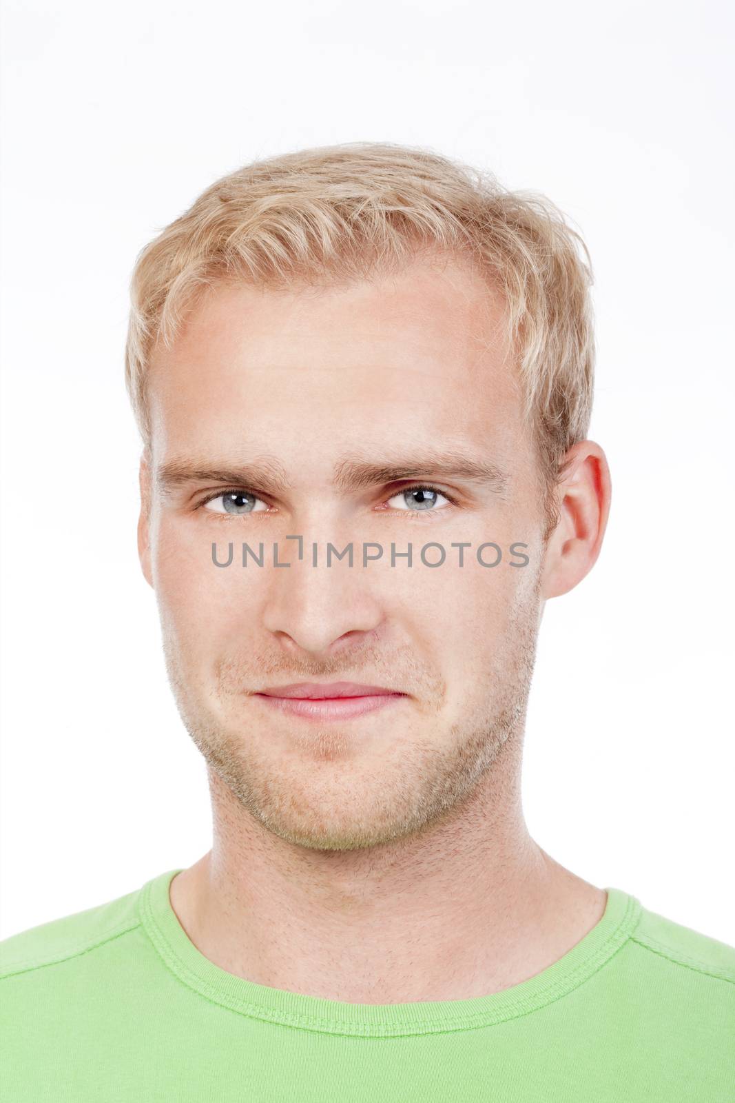 portrait of a young man with blond hair in green top smiling - isolated on white