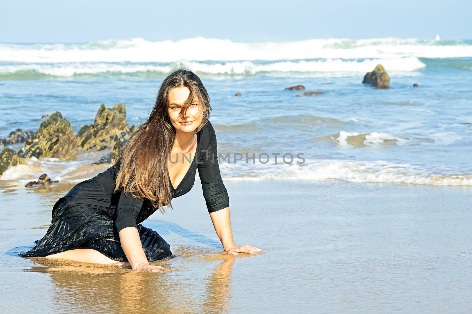 Beautiful woman in the water from the ocean by devy