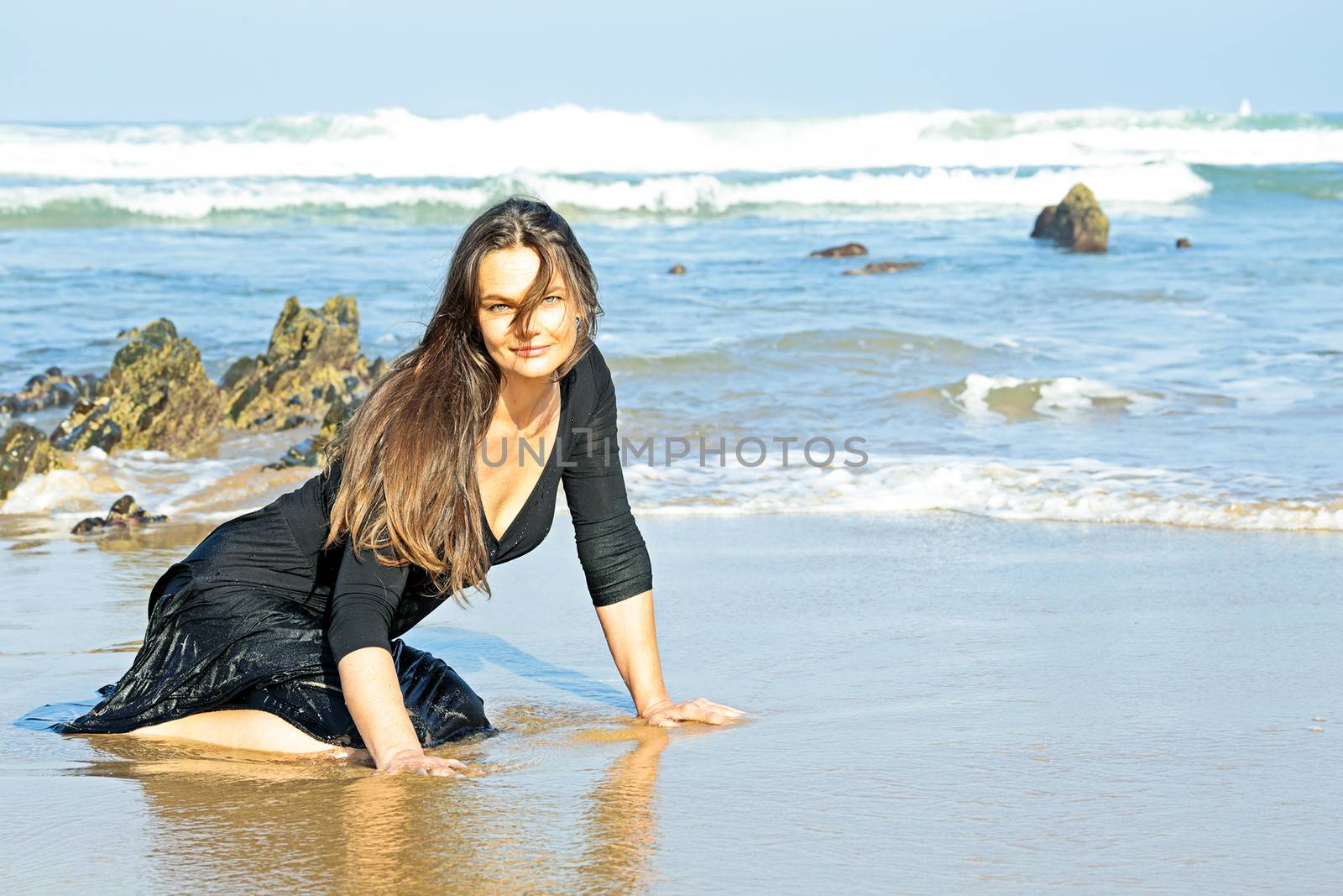 Beautiful woman in the water from the ocean