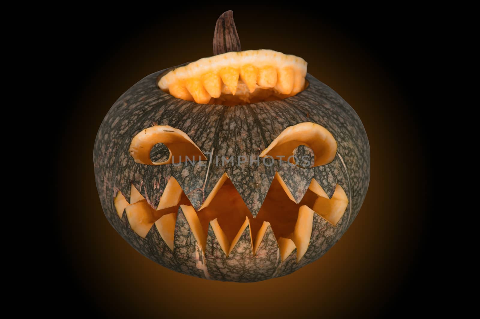 Halloween pumpkin with scary face on black backgound