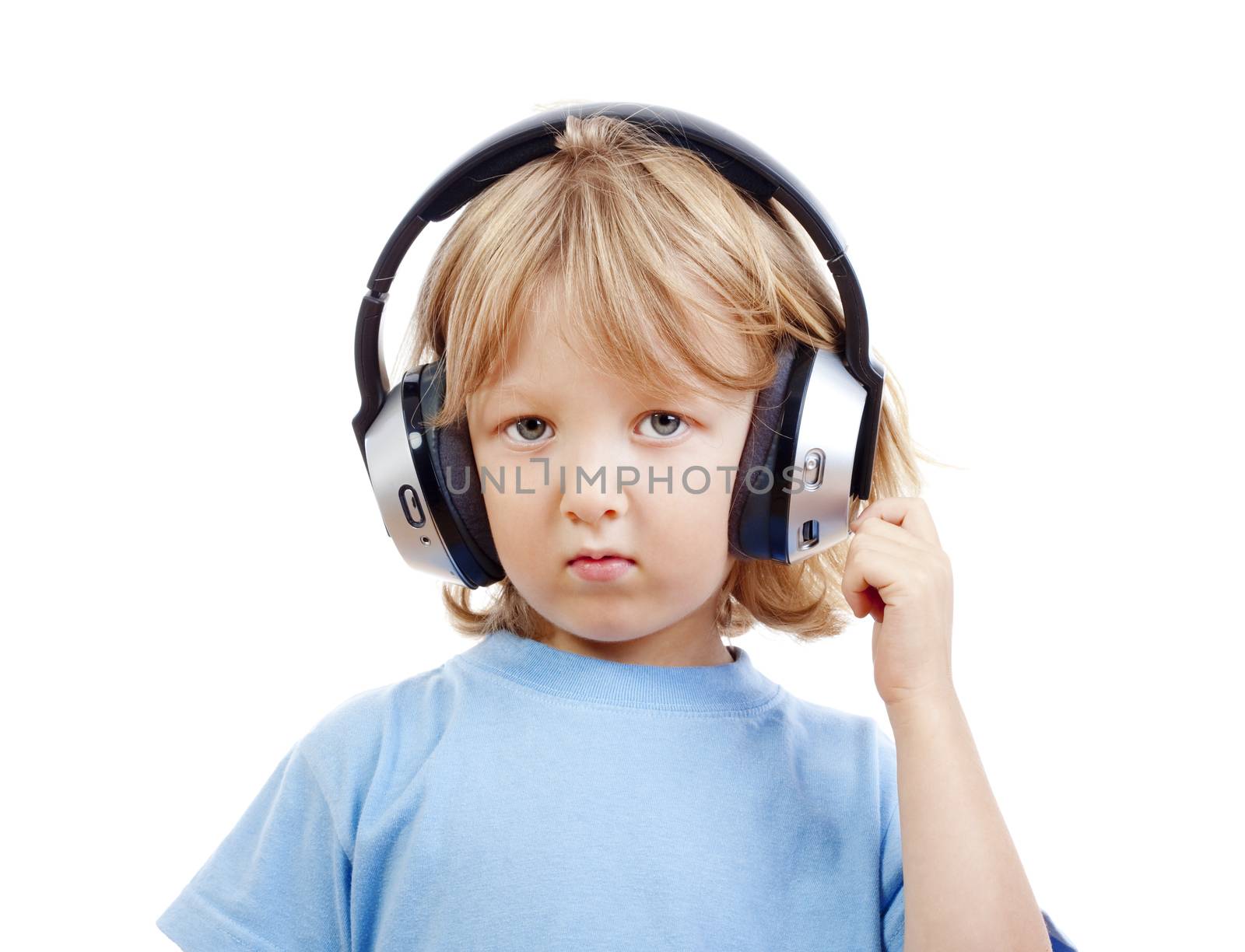 boy with long blond hair listening to music in headphones - isolated on white