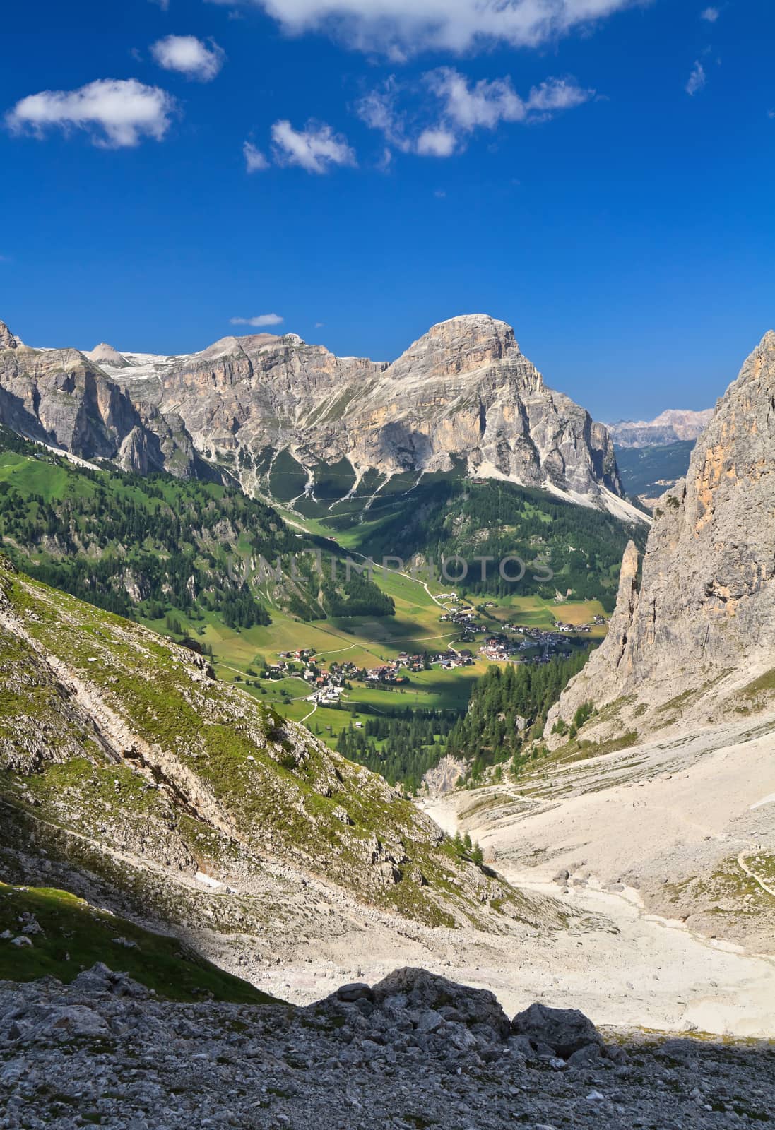 overview of Colfosco village in Badia Valley, on background Sassongher mount