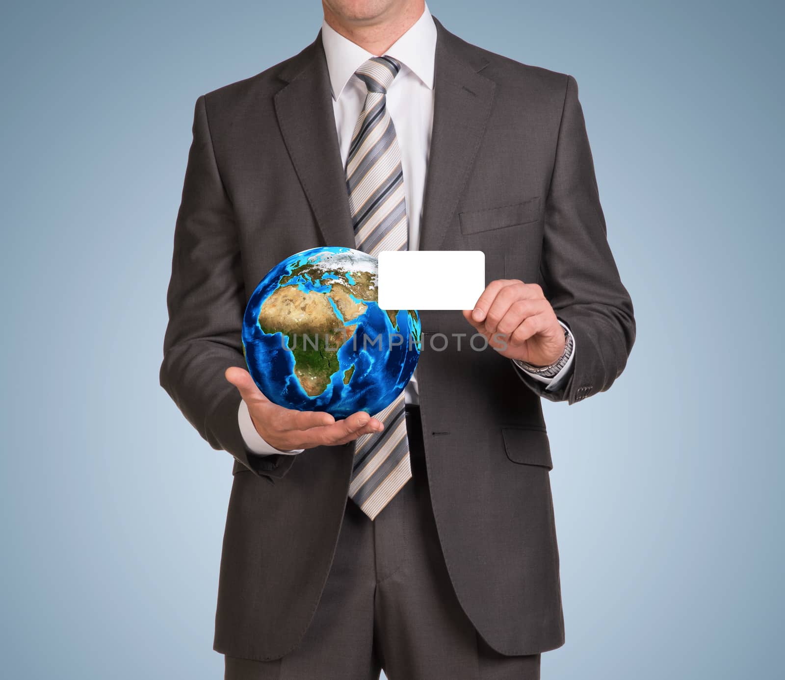Businessman in suit hold empty card and Earth by cherezoff