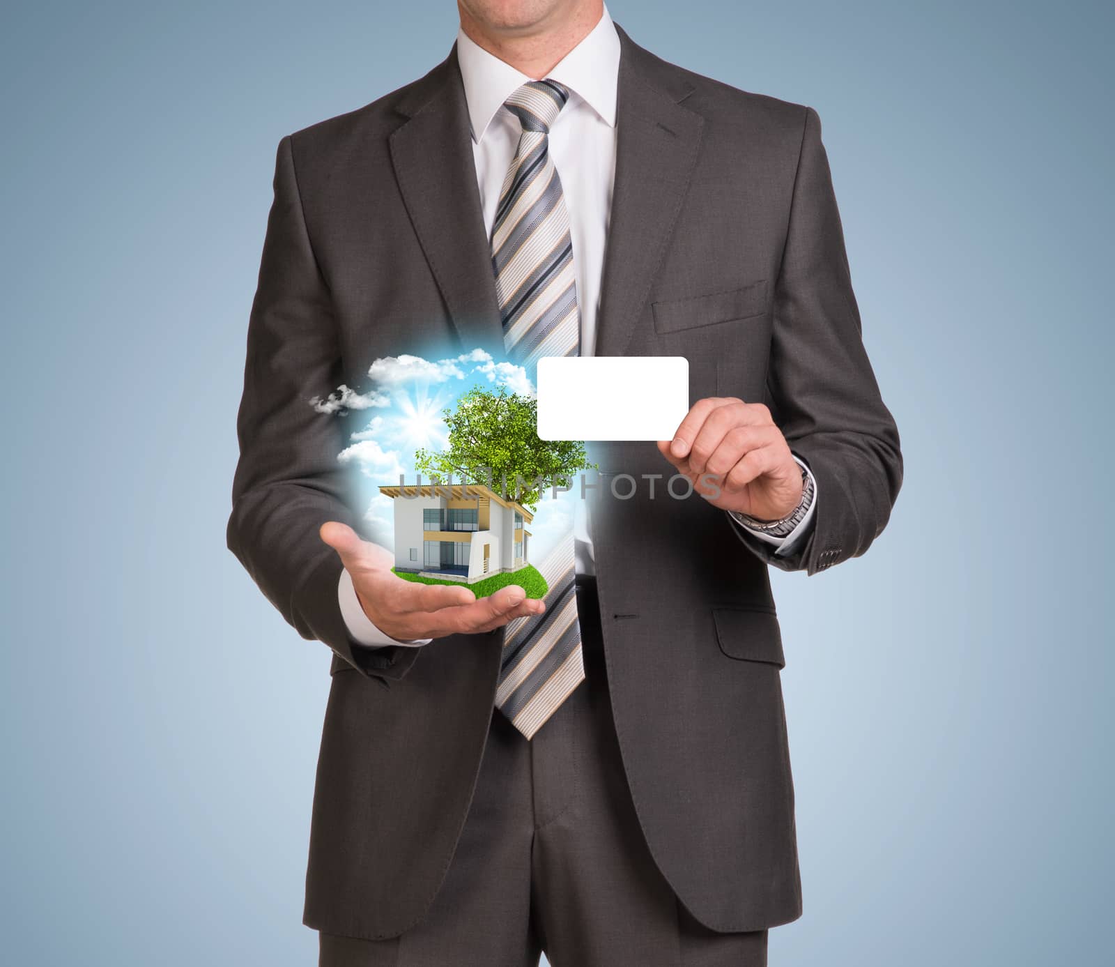Businessman in suit hold empty card and nature landscape with small house. Blue background