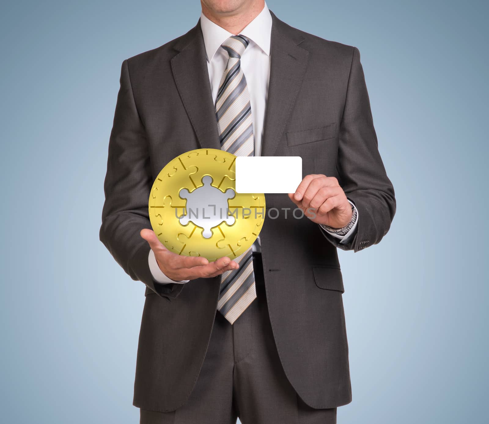Man hold empty card and jigsaw puzzle sphere by cherezoff