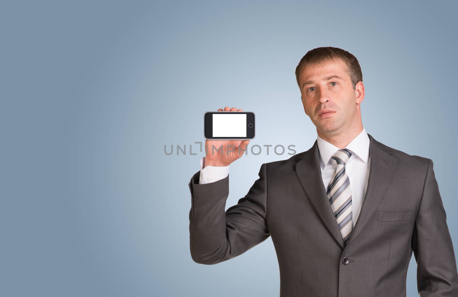 Businessman in suit hold smart phone with empty screen by cherezoff