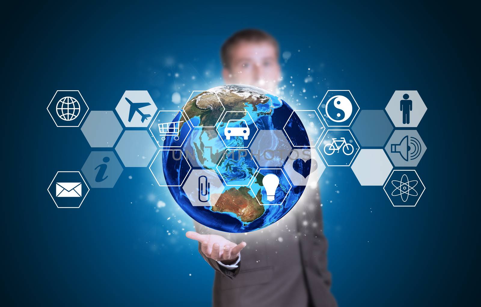 Businessman in suit hold Earth and hexagons with icons. Elements of this image are furnished by NASA