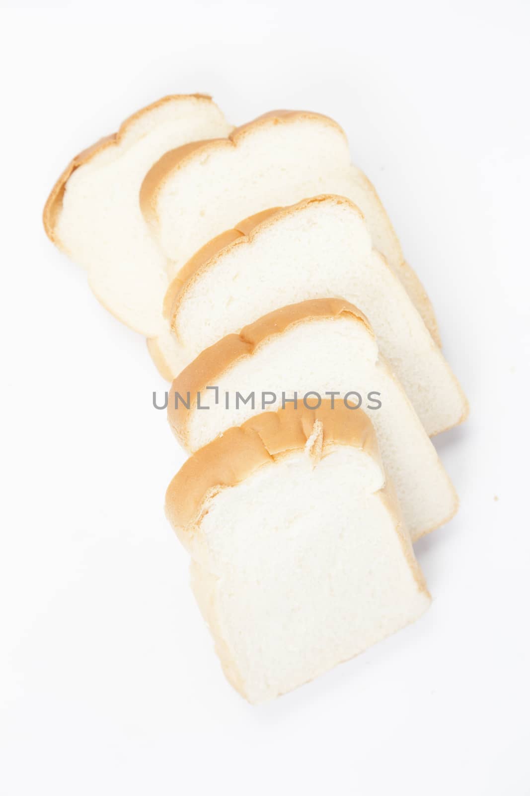 Sliced ������bread on a white background. Bread stacked in rows.