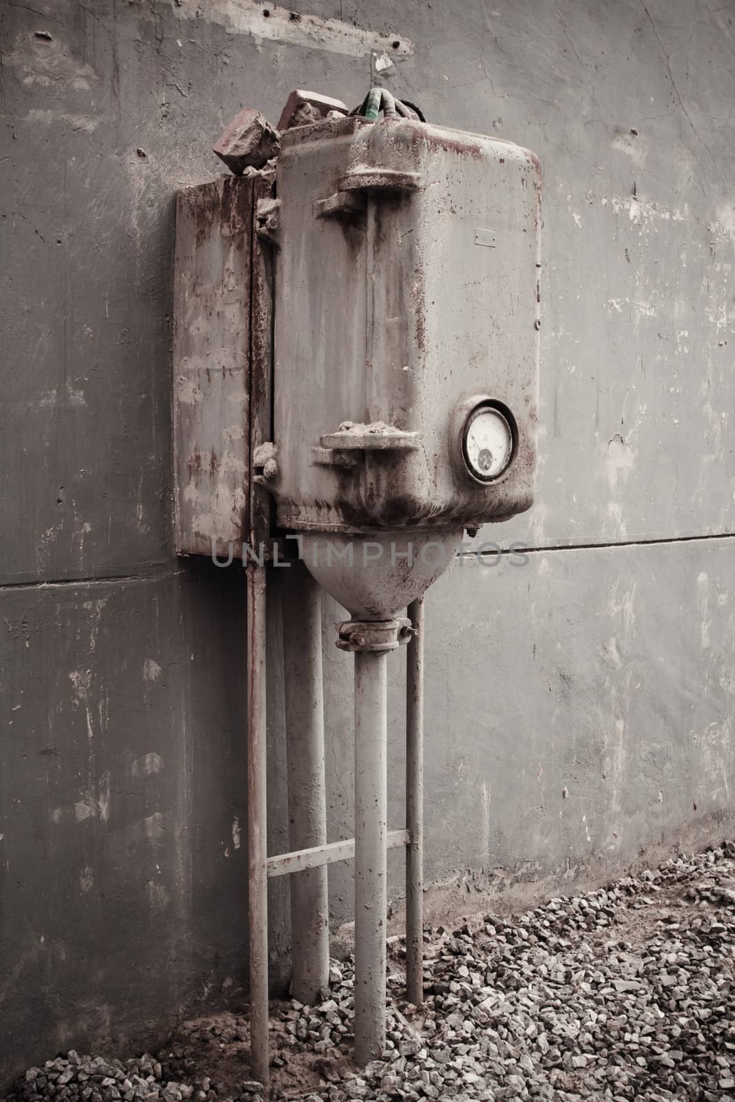 The old machinery instrument beside the wall