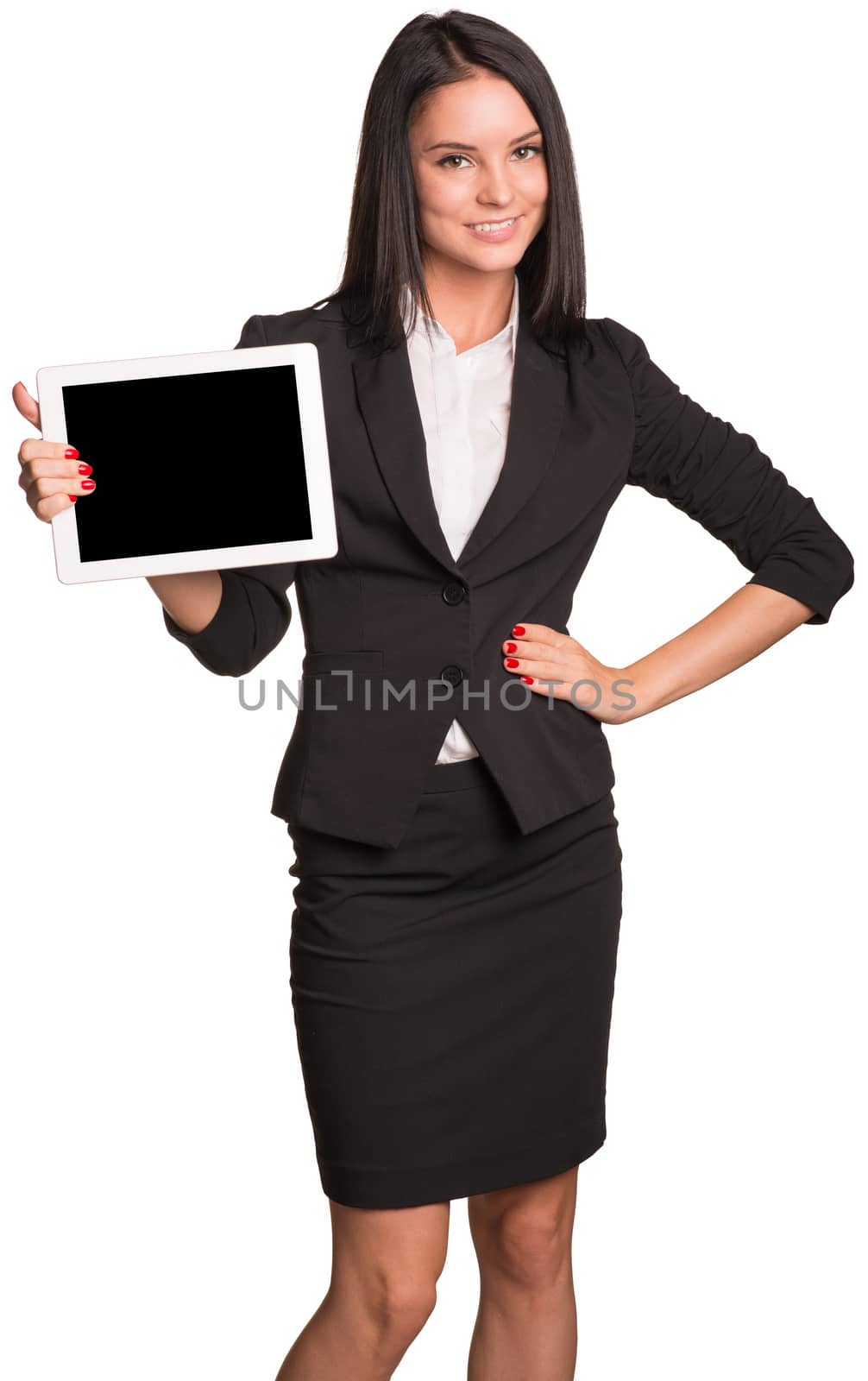 Beautiful businesswoman in suit holding a tablet. Hand on hip. Isolated on white background