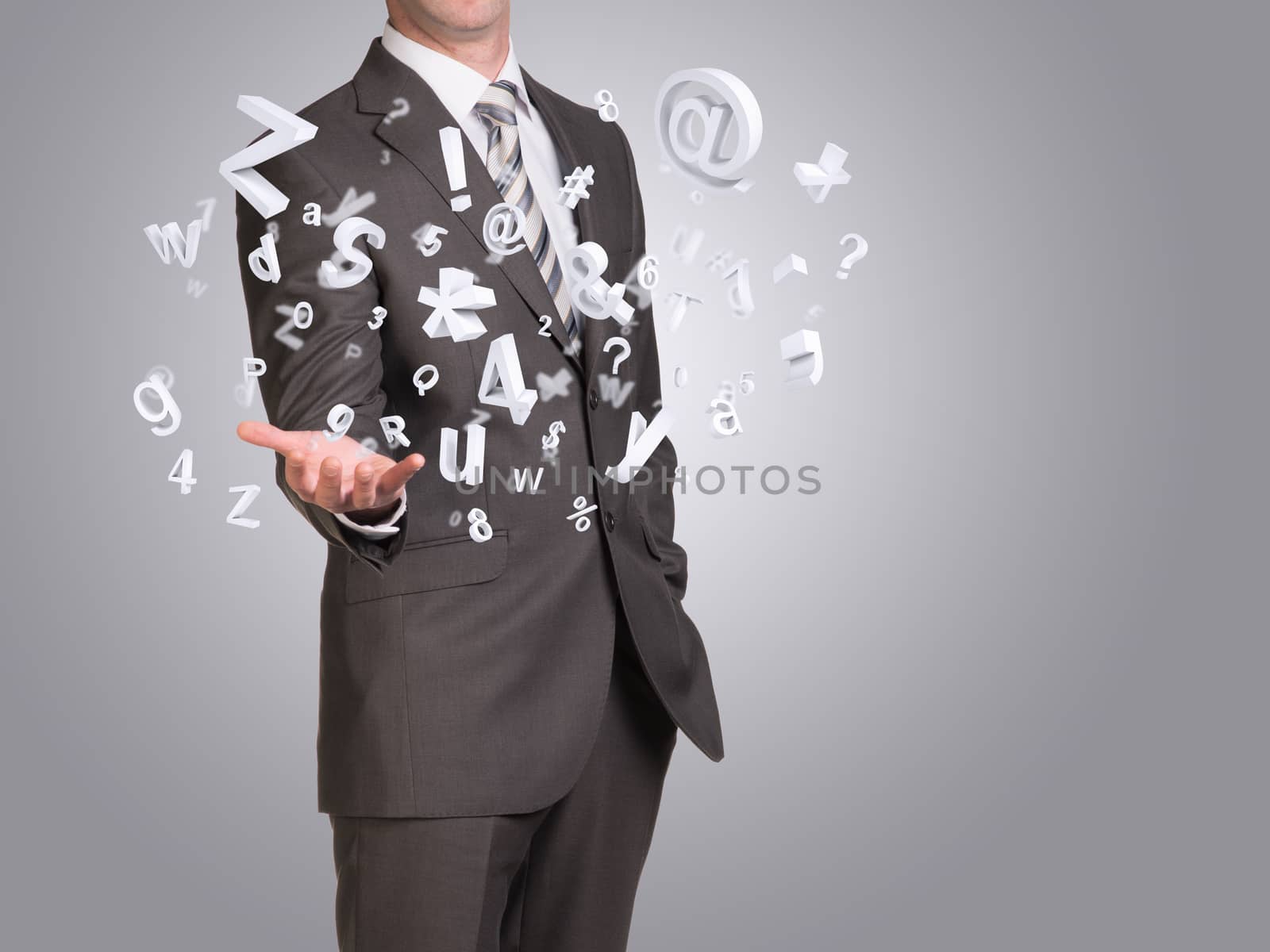 Businessman in suit hold empty hand with flying figures. Blue background