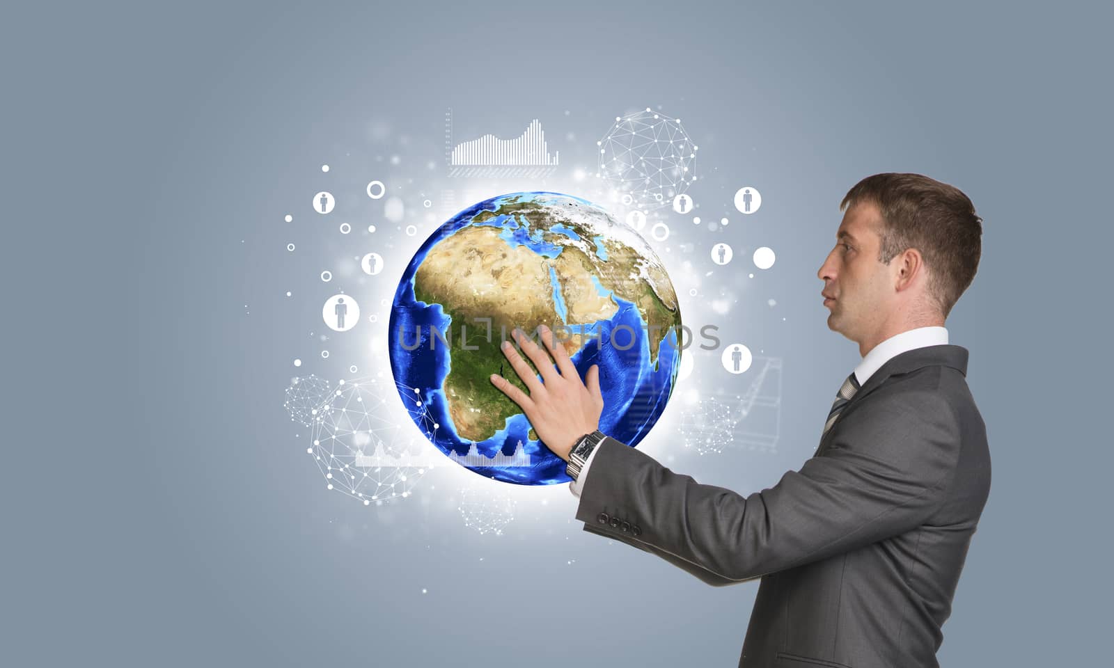 Businessman in suit hold Earth with graphs and network by cherezoff