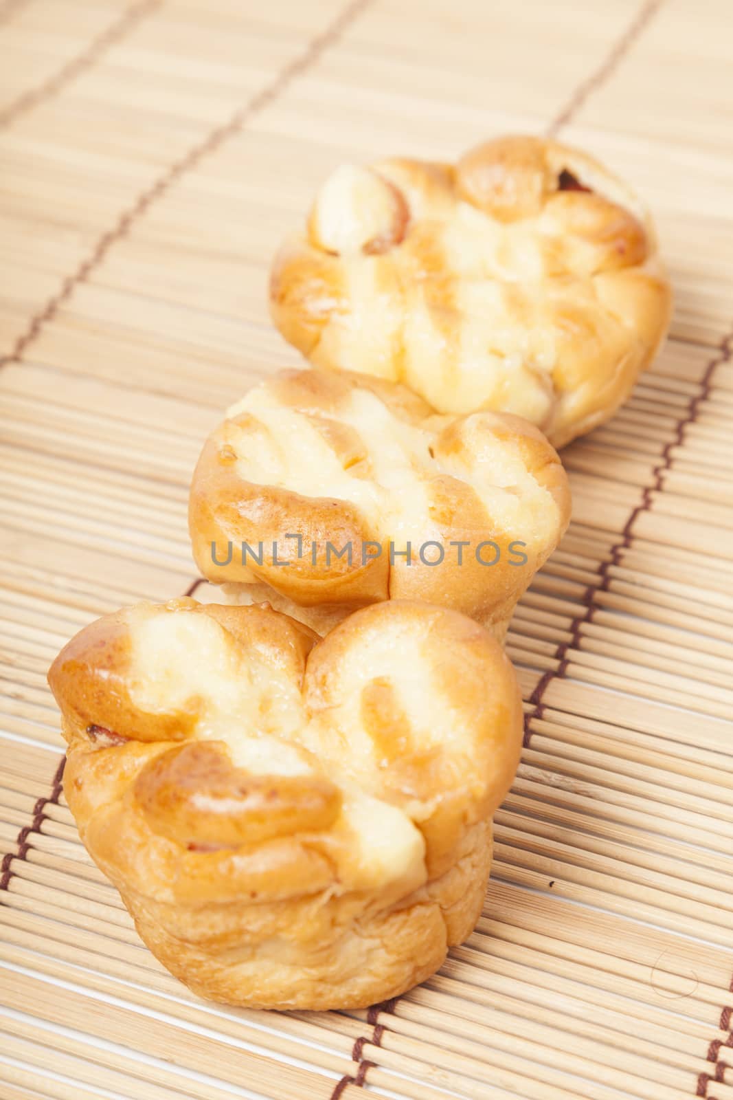 Loaf of bread on wooden plate.pack-shot in studio.