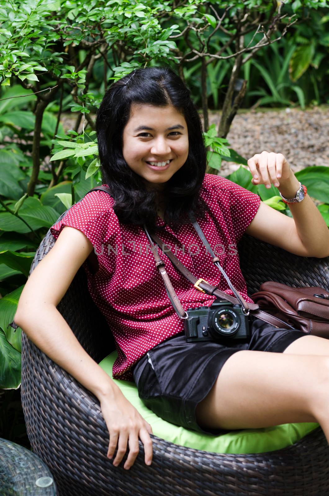 Beautiful asian girl with retro camera, outdoor