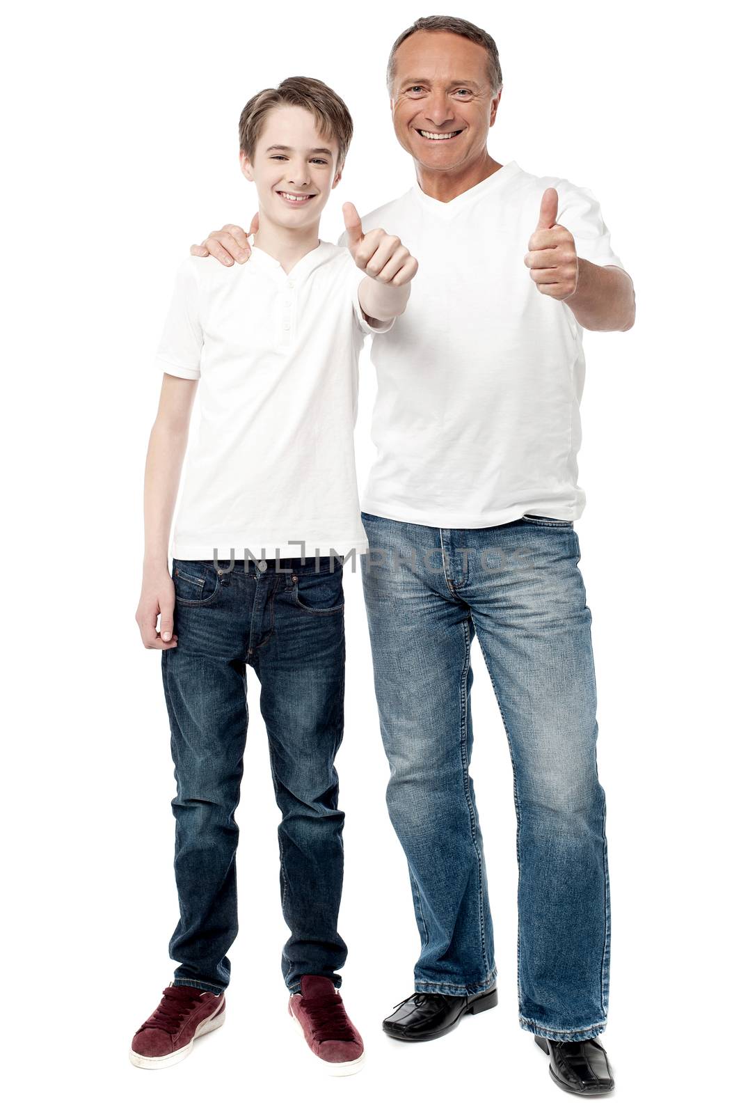 Happy father and son showing thumbs up gesture