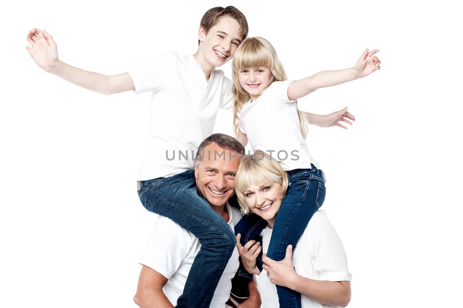 Playful family of four isolated over white by stockyimages