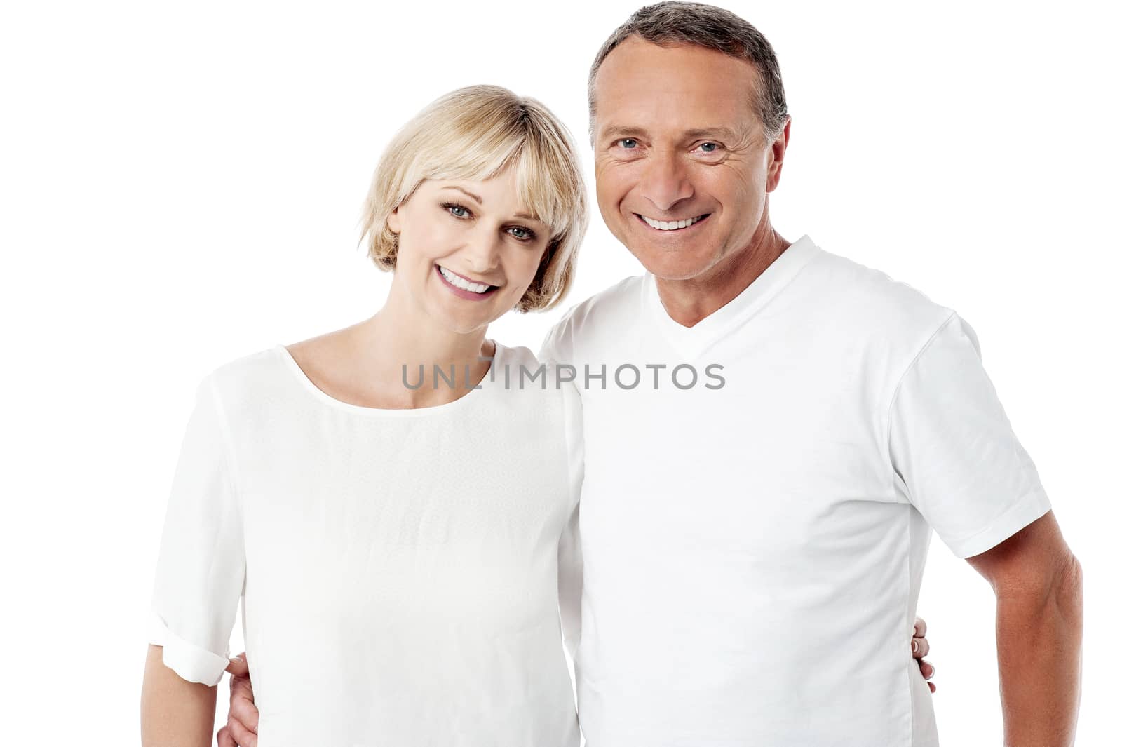 Smiling senior couple posing over white background