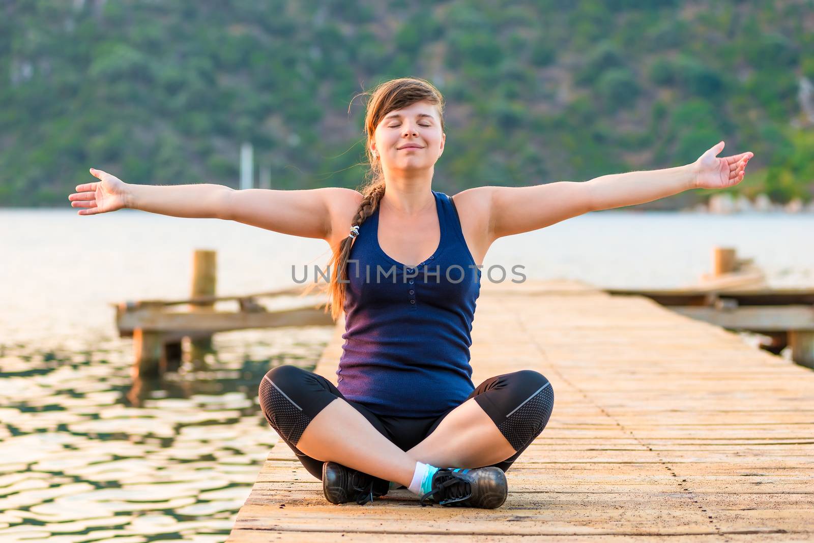 young girl with arms outstretched in the lotus position by kosmsos111